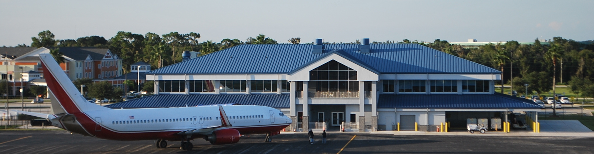 Plane in front of a building